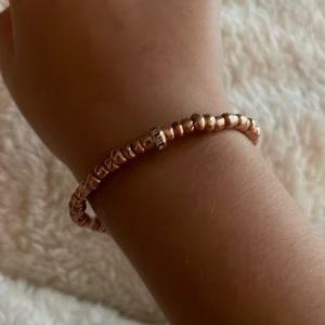 Rose gold with rose gold charm with fake diamond